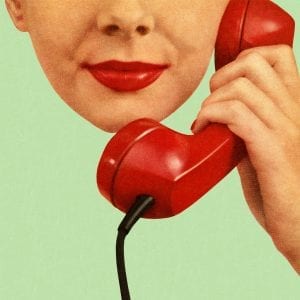 Woman Holding Red Phone to Her Ear
