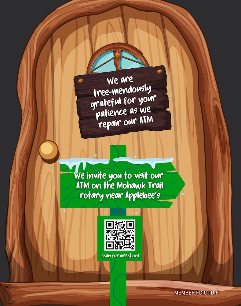 Hobbit style door which reads "We are tree-mendously grateful for your patience as we repair our ATM."